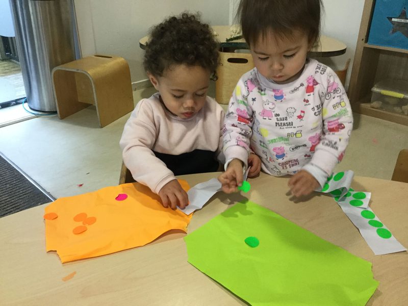 Sticking stickers The Learning Corner Ellerslie
