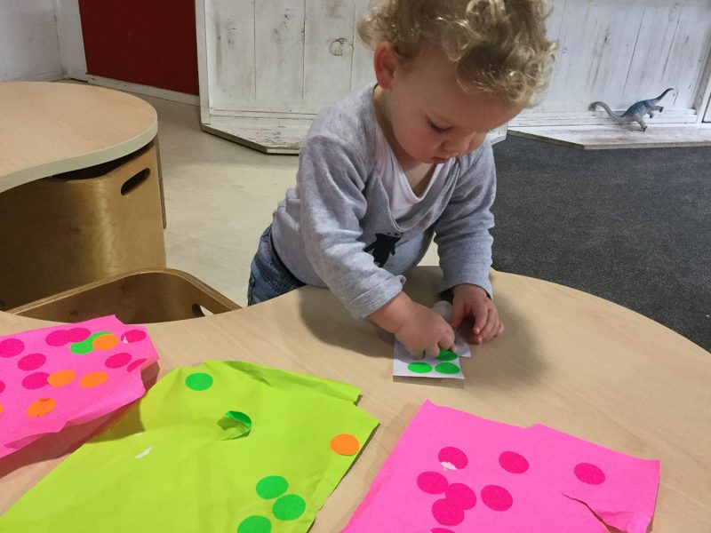 Sticking stickers The Learning Corner Ellerslie